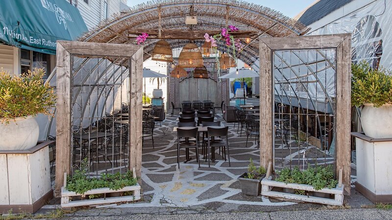 Outdoor dining area under tent